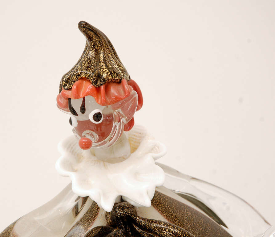 A single Murano glass clown in aubergine-edged black and white stripes flecked with gold. It would make an excellent companion to either of the other two pairs we have listed.