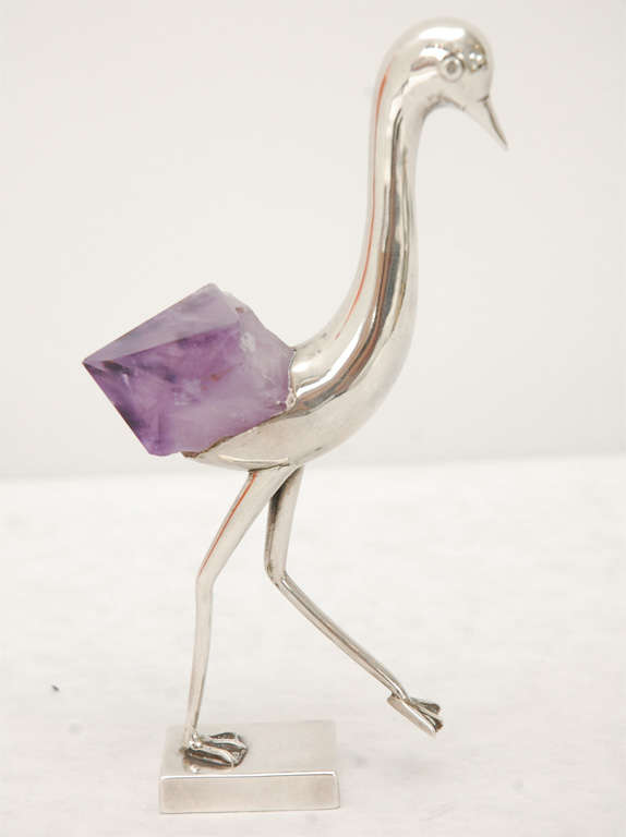A playful amethyst and sterling silver ostrich statue walking off its base stamped 