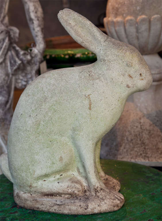 This large cast stone bunny is just charming! With a lightly weathered and greening surface, he will continue to age and eventually grow moss if placed in a moist and shady spot. Perfect standing sentinel by your door or peeking out from a shrub in