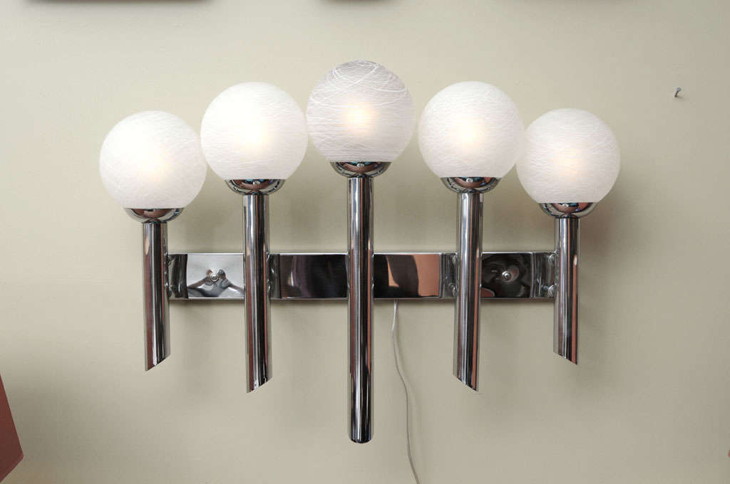 REDUCED FROM $1250....Modernist, grand, regal and impressive, this large-scale wall light features five graduated in height vertical arms, each with a Murano satin glass orb globes with white spider webbing applied striations. Crisp, clean and fat