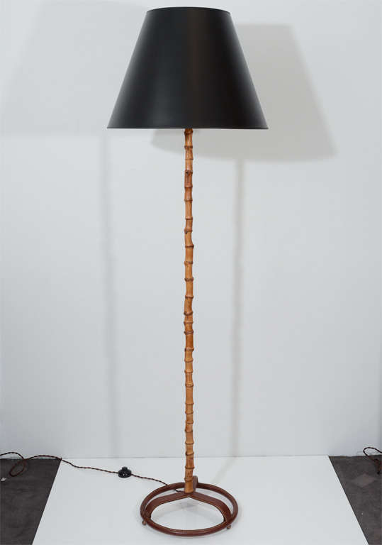 Fine and rare bamboo floor lamp by Jacques Adnet with saddle-stitched leather base

Diameter of shade: 24”