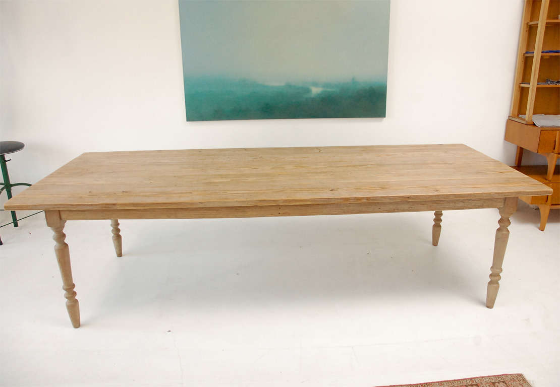 Classic style farm table made with salvage wood with hand turned wood legs.