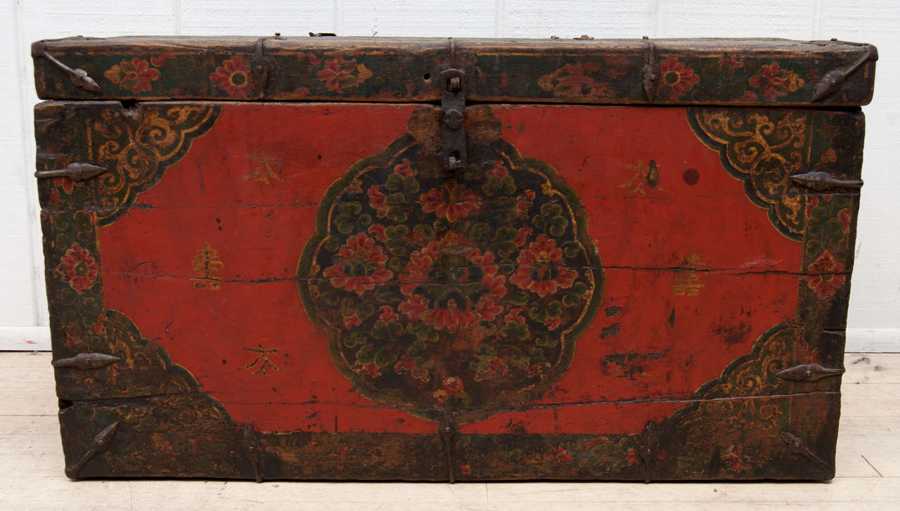 This rare collector's handpainted and handhewn Tibetan trunk retains its original polychrome lacquered paint and all the original iron hardware. Uniquely weathered and worn it is embued with character from centuries of use.