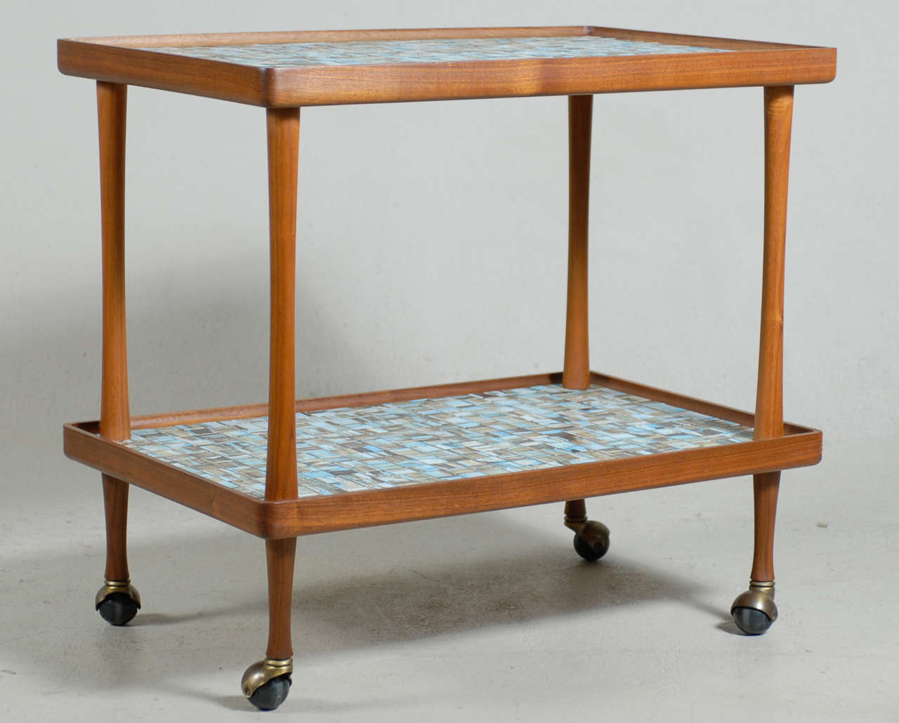 Rare, 1960s Gordon Martz tile and oiled walnut bar/tea cart by Marshall Studios.

This piece is located off-site, to view in person please contact City Issue to make an appointment at the showroom.