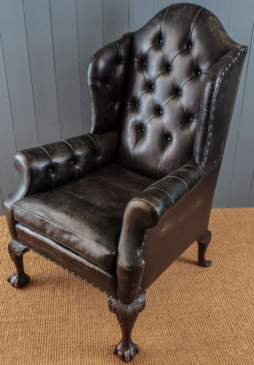 Magnificent scale, this gentlemans carved mahogany armchair has been upholstered in aged leather and is truly imposing...