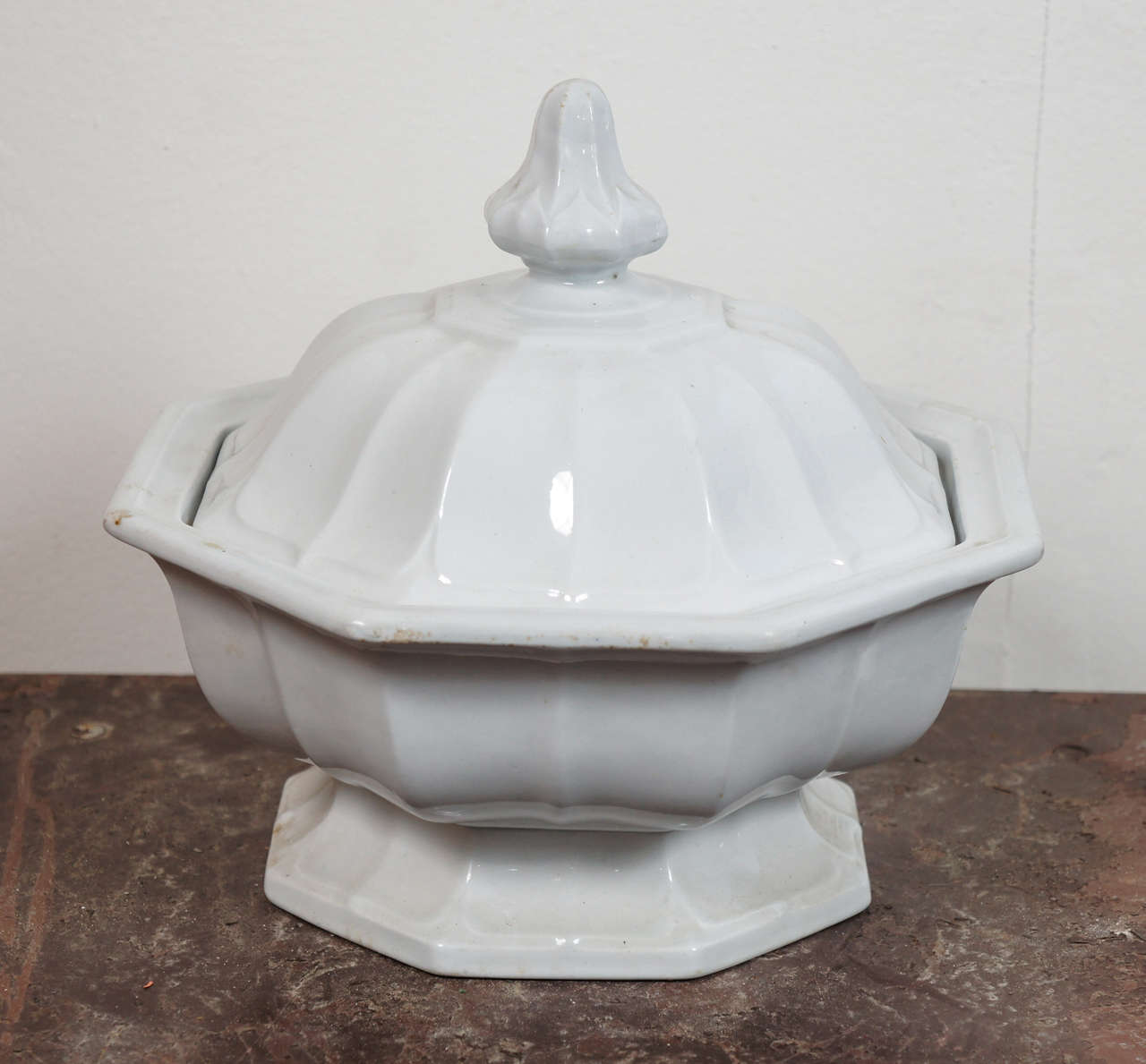Everyone needs a useful tureen for vegetables or small container for serving soup. White ironstone footed tureen and cover.