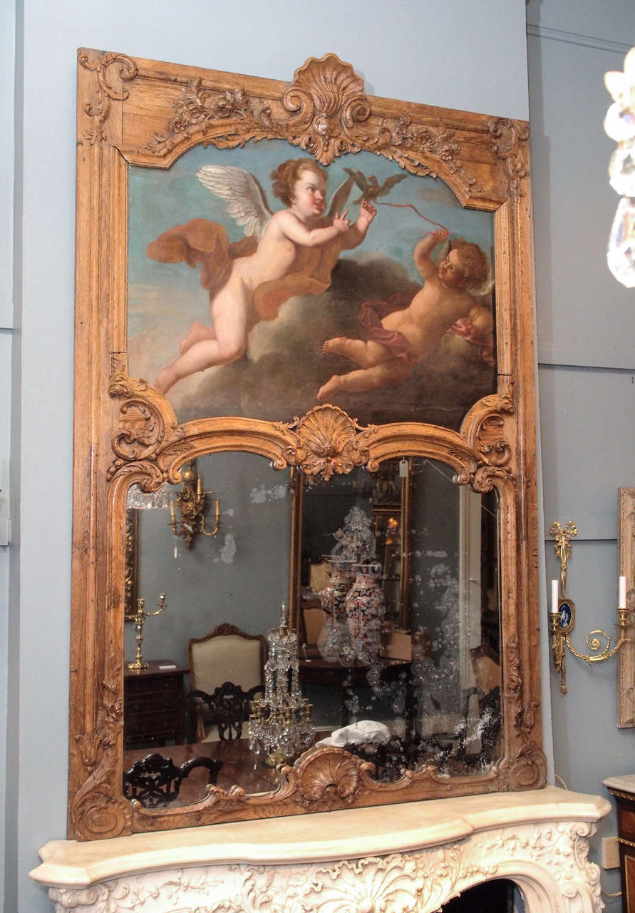 Finely sculpted chestnut frame with oil on canvas. Mirror has been replaced.