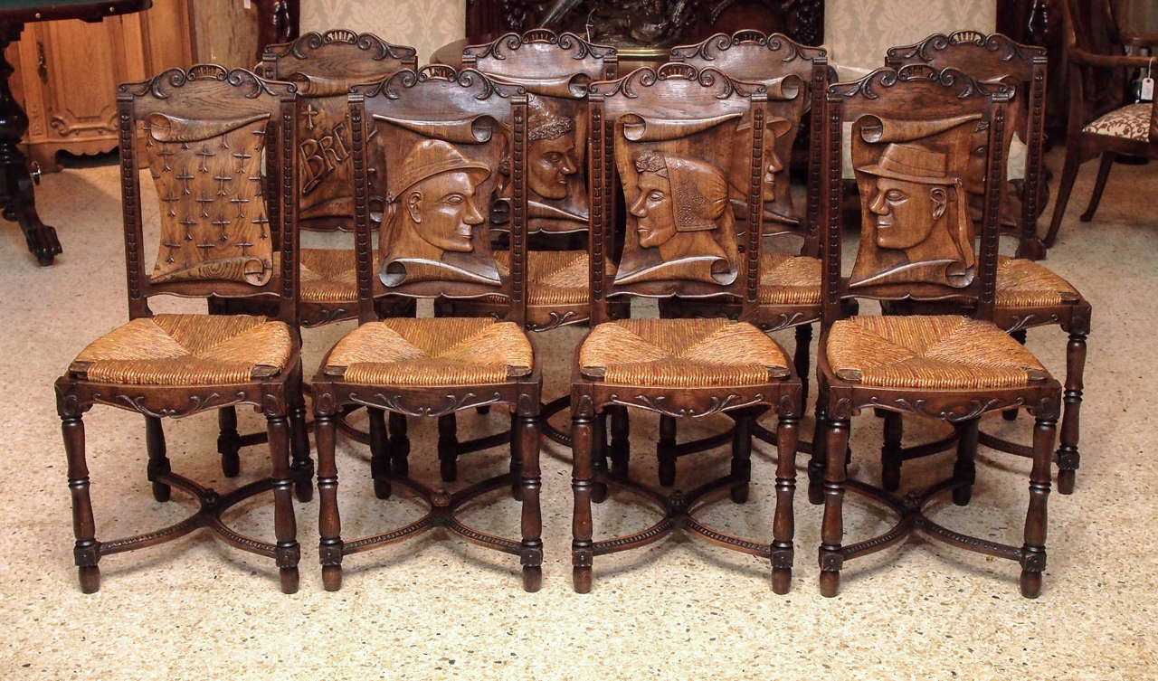 Set of 8 antique French carved Brittany country chairs.