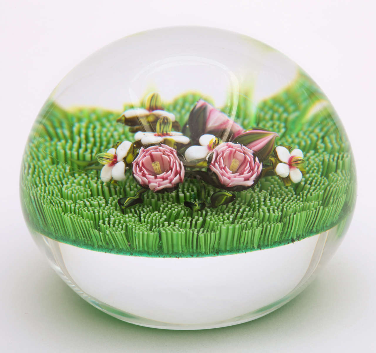 Ken Rosenfeld miniature paperweight with pink Clichy type roses, blossoms and bud on a green moss ground