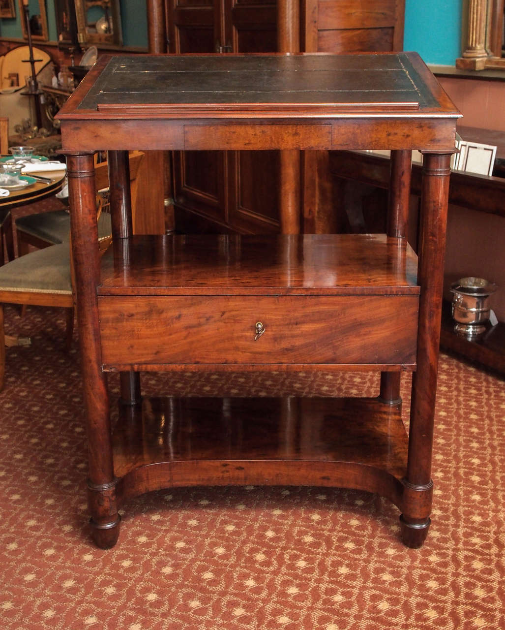 Early 19th century French Empire period mahogany gentleman's library stand/ desk, with leather top, centre and side drawers, and candle slide, circa 1810.