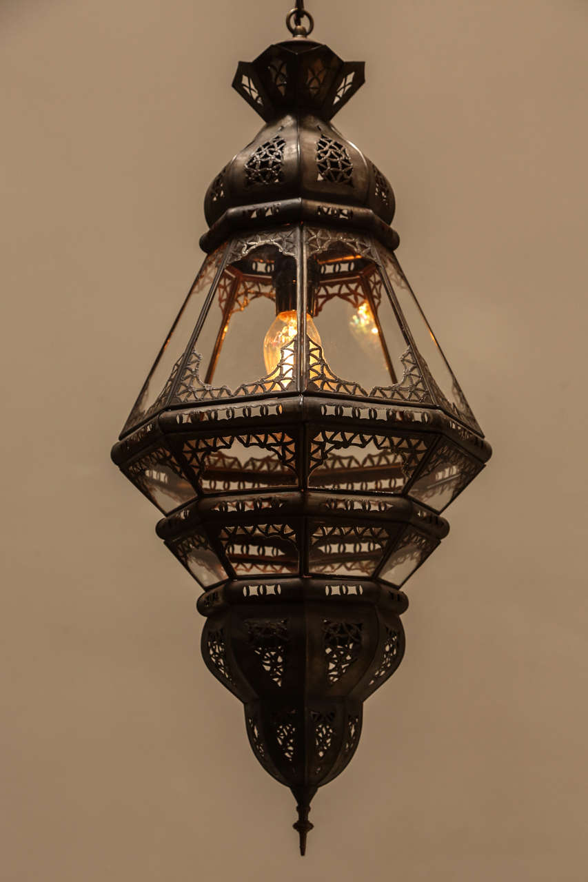 Elegant and Stylish clear glass handcrafted Moroccan lantern with intricate filigree work in the Moorish style.
Will add elegance in any room. Could be used as a wall sconces or chandelier hanging from the ceiling.
Rewired with 1 lights, ready to