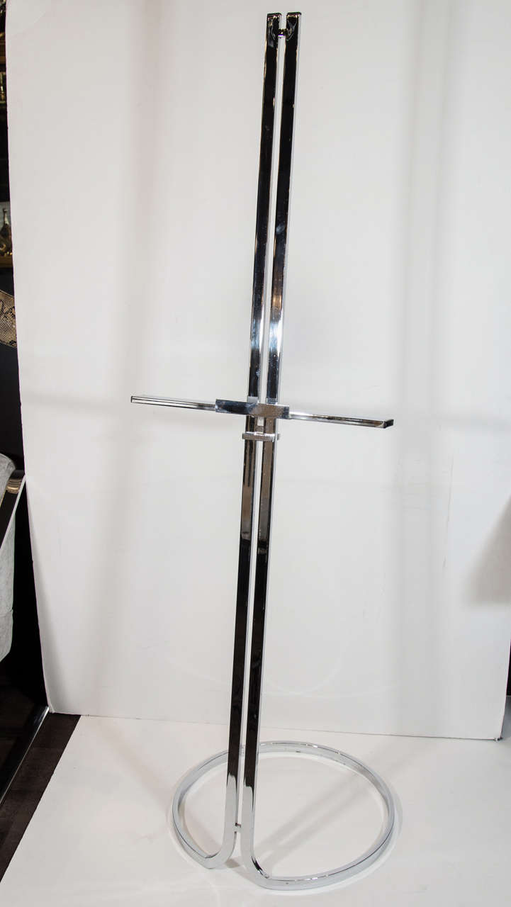 Italian vintage modern art easel or music stand in polished chrome. Easel has double stem design with adjustable ledge and a stylized circular base.