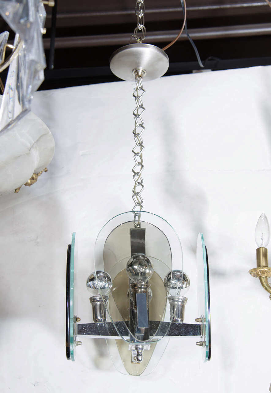 Italian architectural mid-century modern pendant chandelier.  Comprised of dual teardrop shades in gray and green glass. Four sided chrome frame, has original diamond link chain with stylized chromed fittings. Great scale for an entry way, hallway,