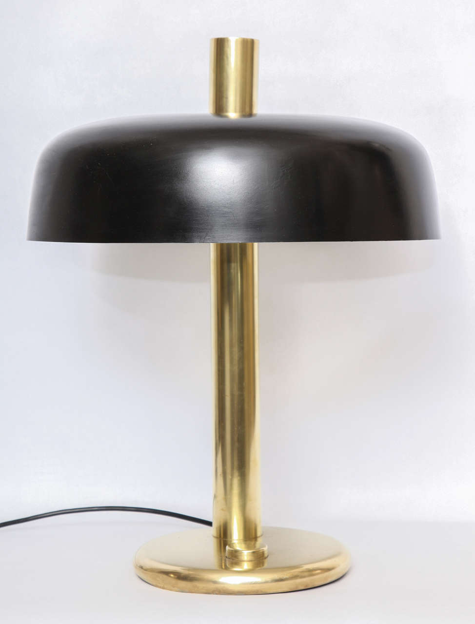 A 1930s American modernist polished and painted brass table Lamp.