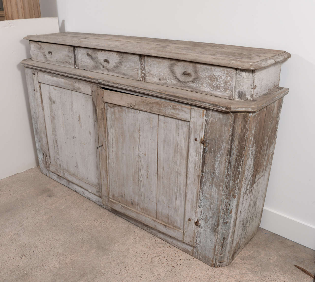 Large 18th century Swedish buffet with two doors, three drawers and remnants of original paint.