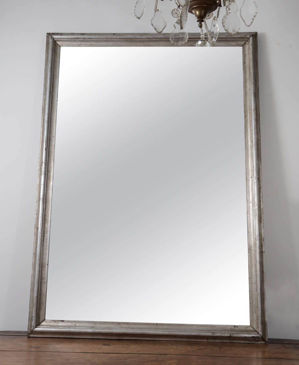 19th century mirror with silver leaf frame.