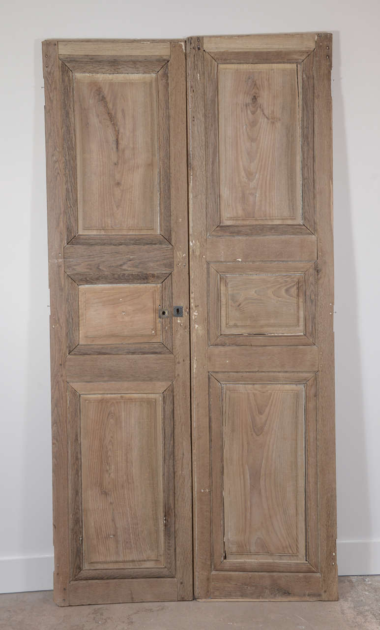 Pair of hand planed and carved doors with iron hardware from Chateau de Gaston Phebus, in Sauveterre, France.