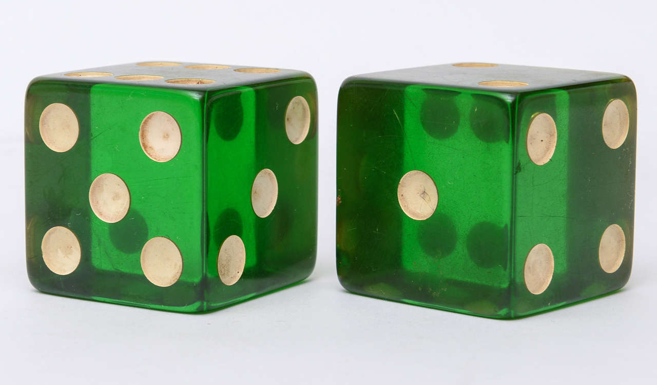 Great as a tabletop object... the rich emerald green of these bakelite dice  are standout!!
Or Great as a desk accessory!