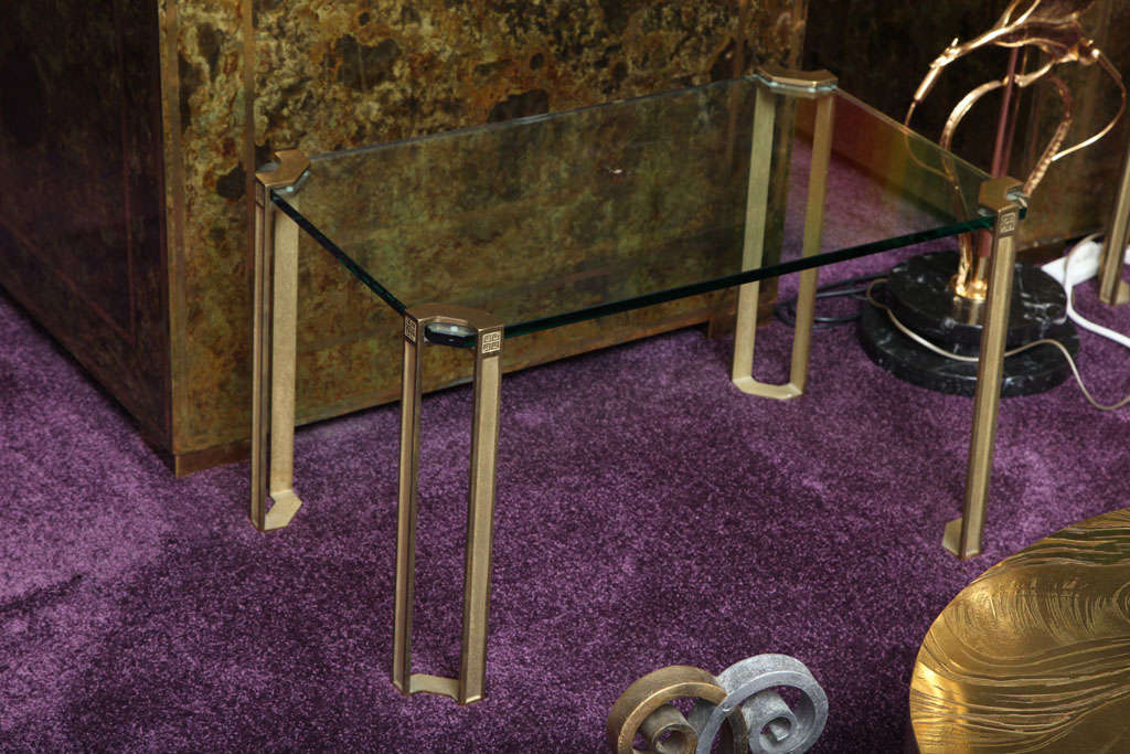 Pair of solid bronze and glass side tables by Van Heeck.