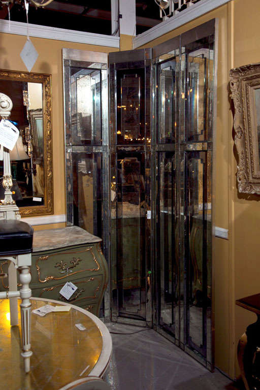 A Four Panel Mirrored Screen by Maison Jansen