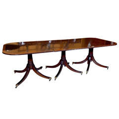 A Triple Pedestal Mahogany Dining Room Table