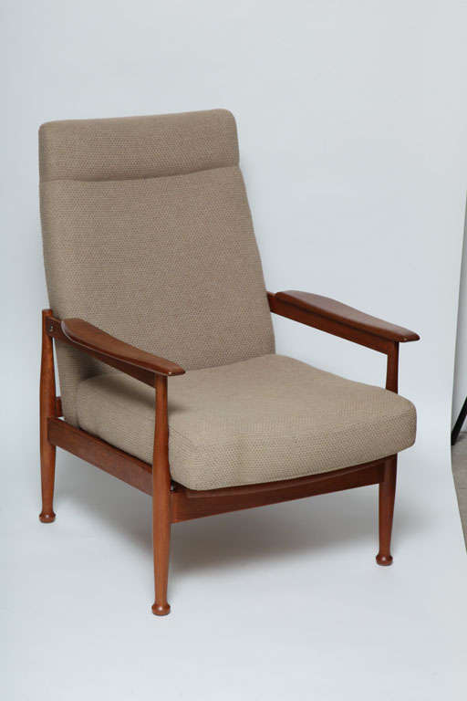 This is a Guy Rogers 'Manhattan' reclining armchair. The 'Manhattan' range is considered to be one of Guy Rogers' best, strongly influenced by the Danish designs. These chairs were handmade in Liverpool, England, and designed by Eric Pamphilon