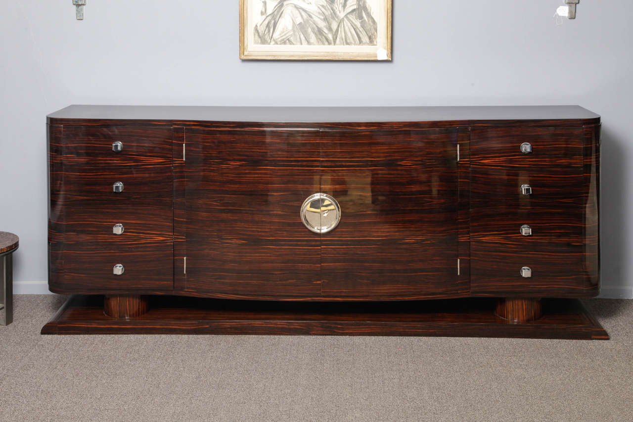 Exceptional Art-deco credenza in ebony macassar veneer ,restored with lustrous hand made french polish. Inside of the cabinet there's possibility to place 1 or 2 shelves.Nickel plated bronze hardware.French origin from 1930.