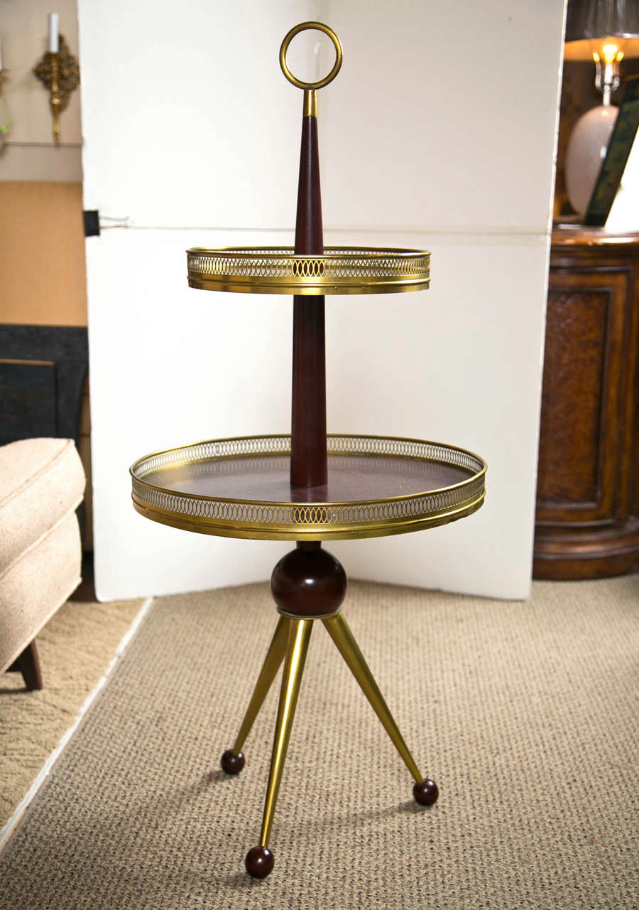 Mahogany pedestal table with brass  galleries and top ring.
Bottom shelf is 18