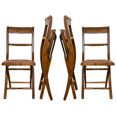 Set of Four Maple Wood Folding Chairs With Cane Seats