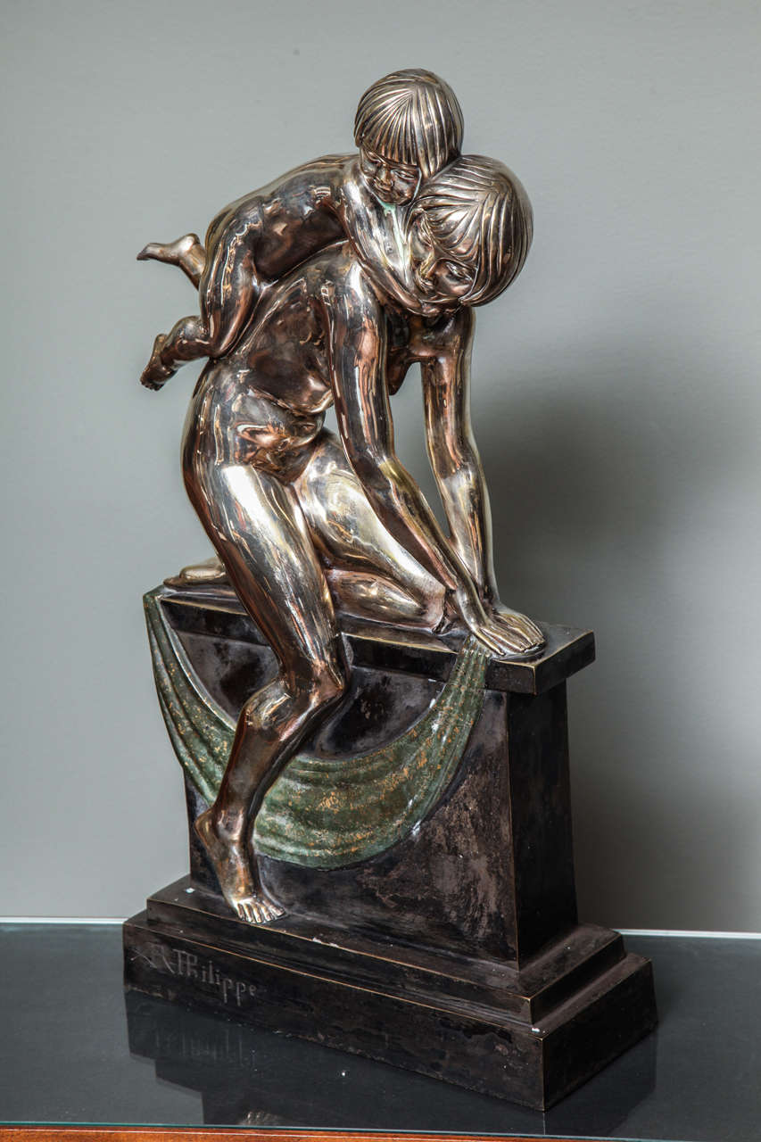 Abel R. Philippe 
"Mother playing with her child," an Art Deco silvered bronze group, on a polychromed bronze base, signed on the base, circa 1930s.