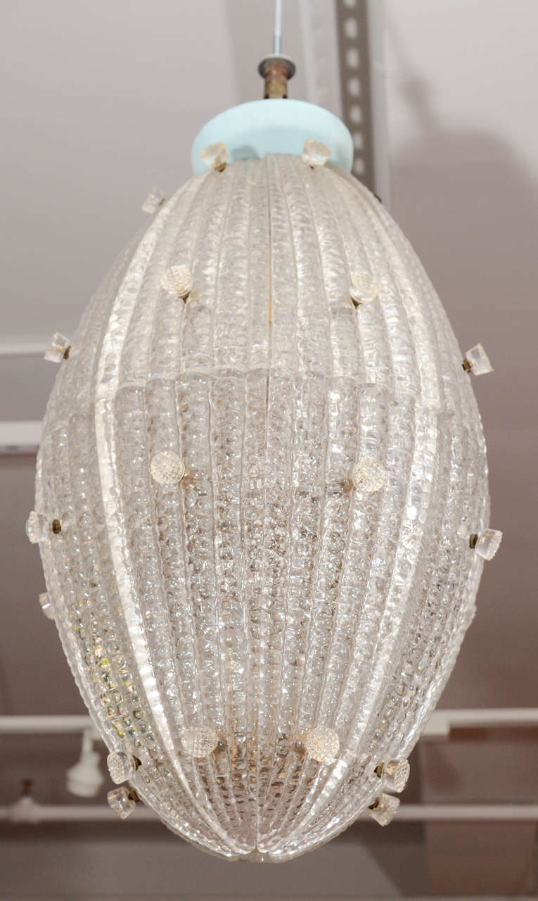 Beautiful Vintage Chandelier by Orrefors with crystal rosettes
and 10 lights, clear bulbs 40 watts.
Original instructions from Hansen included.