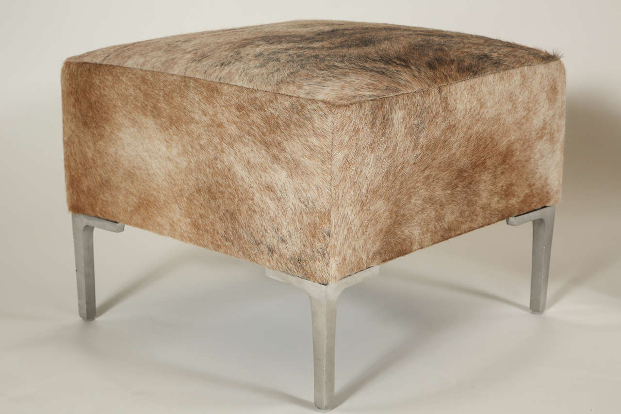 Pair of Cowhide Ottomans at 1stDibs