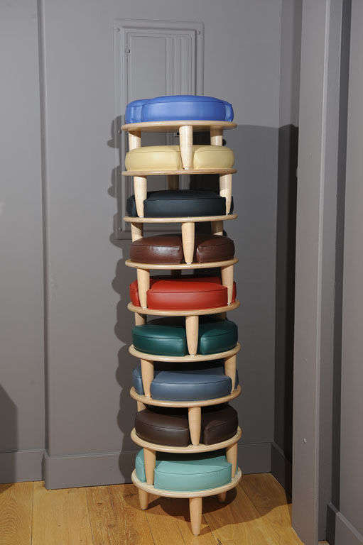 A plywood and vinyl stack-able stool that can be used as a single stool, a footstool or as an occasional table. Can be made to order. Priced per stool.