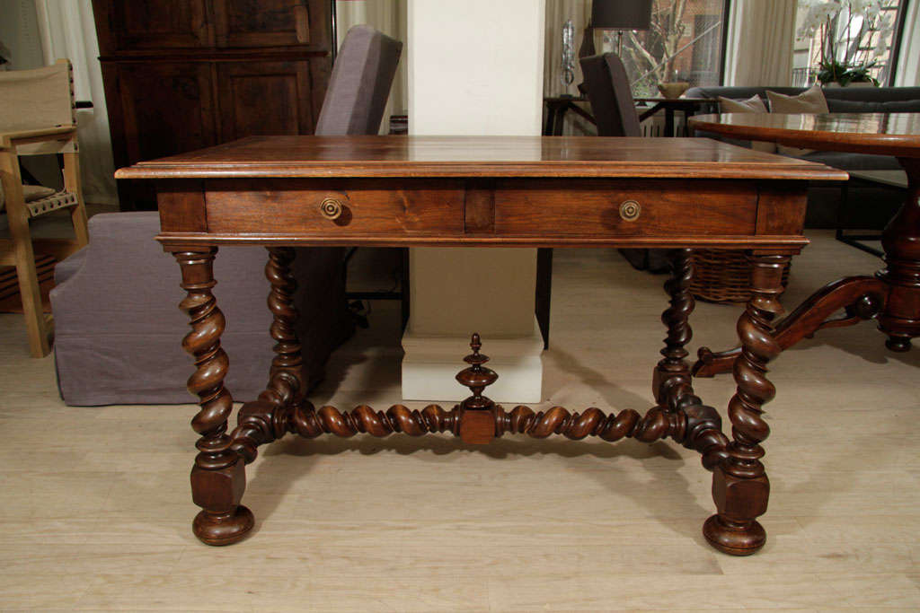19th century two-drawer walnut table with barley twist legs.