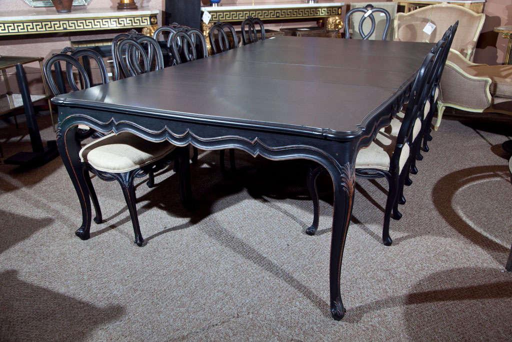 A fine set of Louis XV Style ebonized dining room chairs 14 in all (2 arm and 12 side) Chairs measure 39