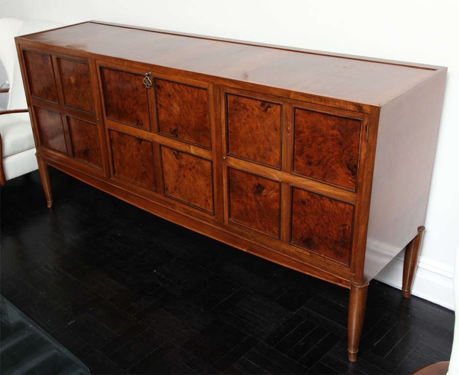 Early 20th Century walnut sideboard, polished top, 3 doors, the center door folds down to reveal 4 interior drawers
