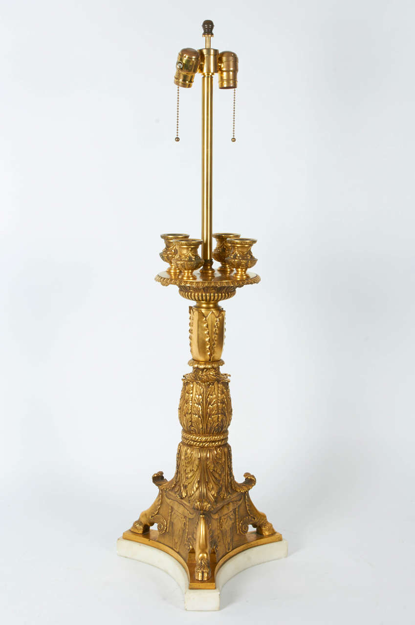 A very large and impressive neoclassical bronze table lamp attributed to E. F. Caldwell and Co, New York City. Very finely hand chased and chiseled gilt bronze in the neoclassical taste, modeled as a four-light candelabra, raised on an original