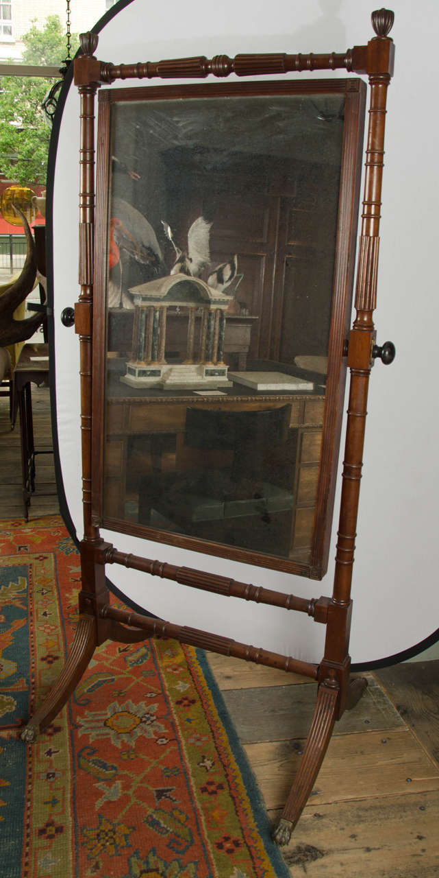 Regency mahogany cheval mirror on standard supports, English, circa 1810.