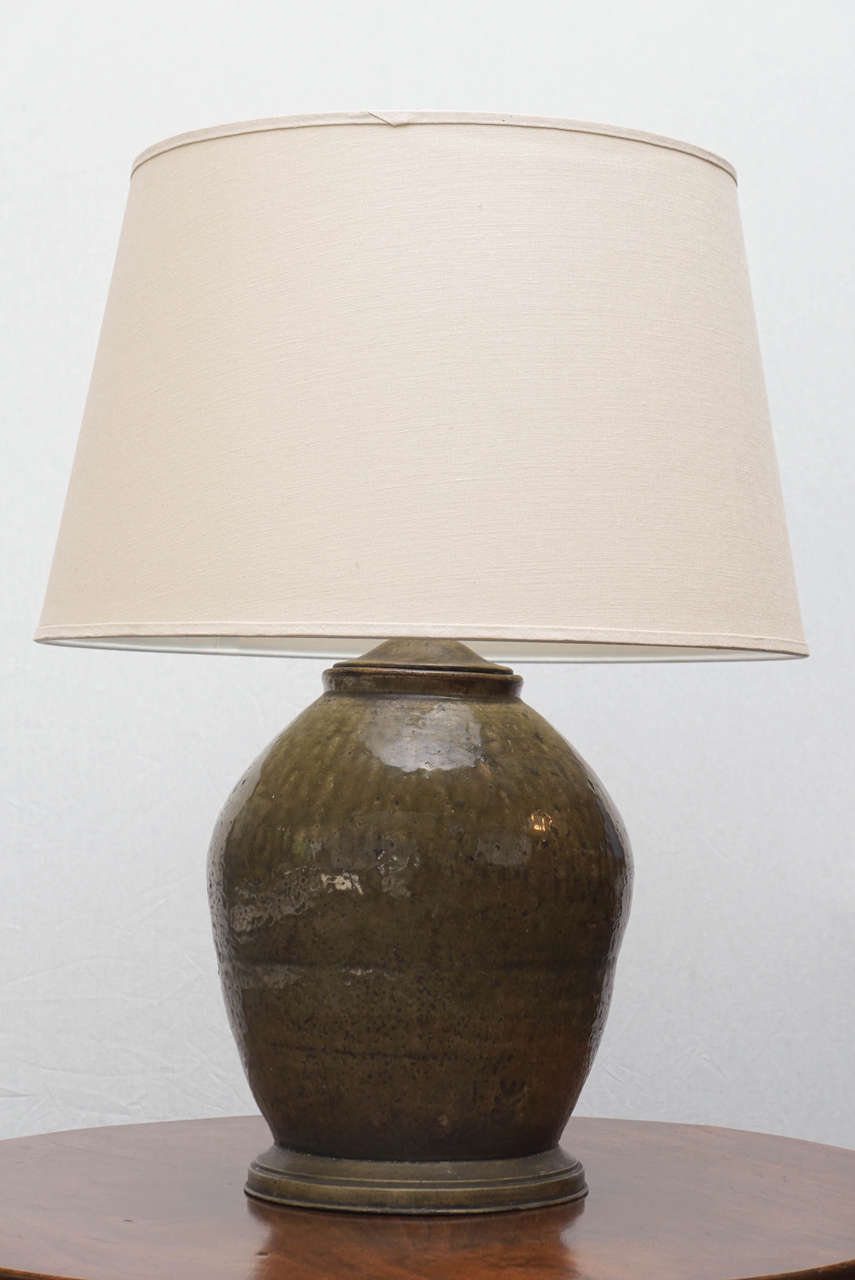 Korean potter storage vase made into lamp with great old brass mounts.