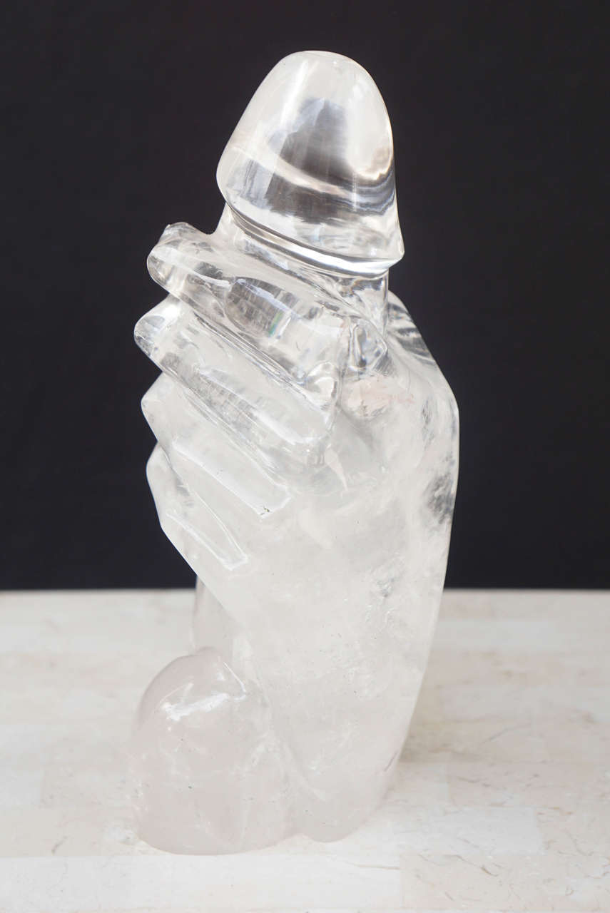 a hand carved rock chrystal in the form of a hand and phallus