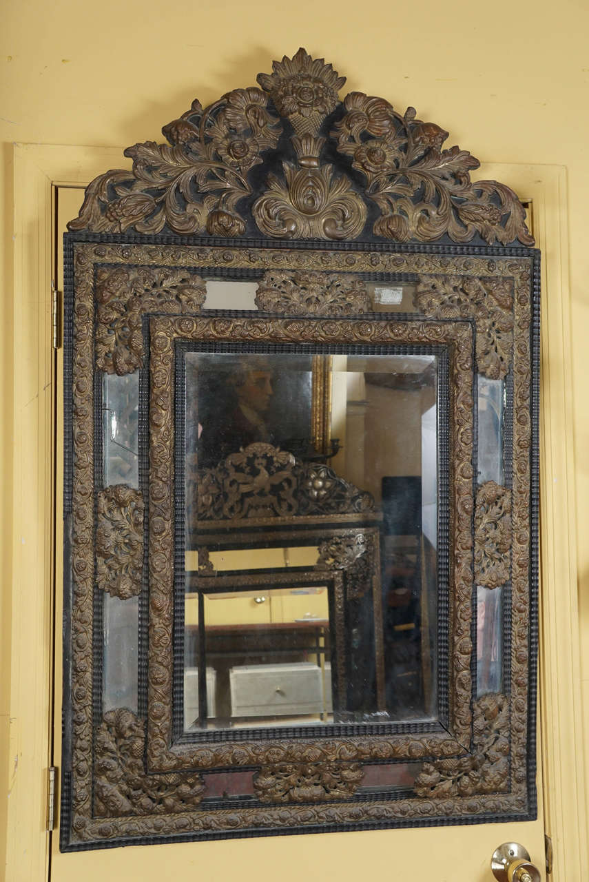 A large mirror with a hand carved wood frame dating from 1890's  French.