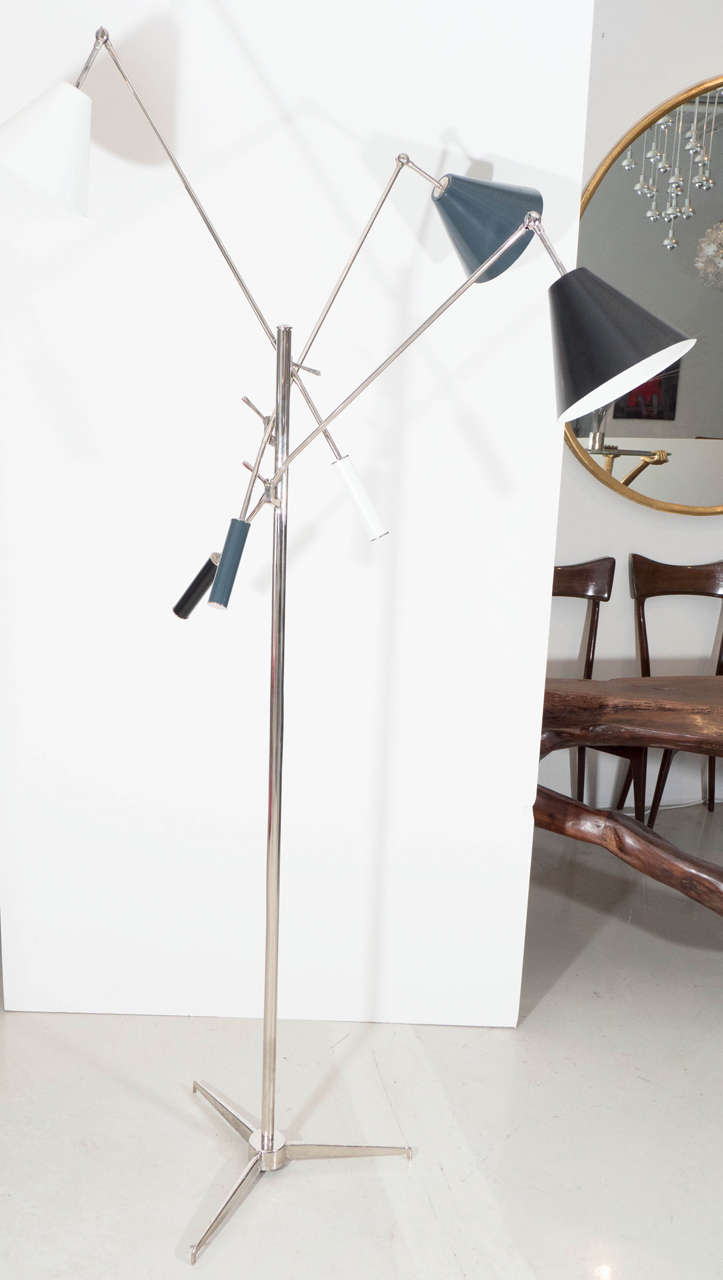 Classic modern Triennale floor lamp with three adjustable grey black and white enameled shades with chrome body and tripod.