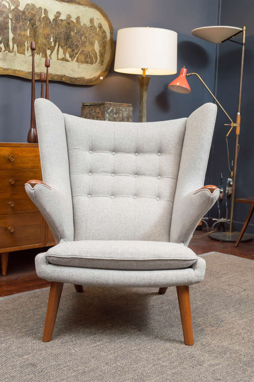 Perfectly refinished and re-upholstered Hans J Wegner Papa Bear chair and ottoman. 
Stamped and dated.