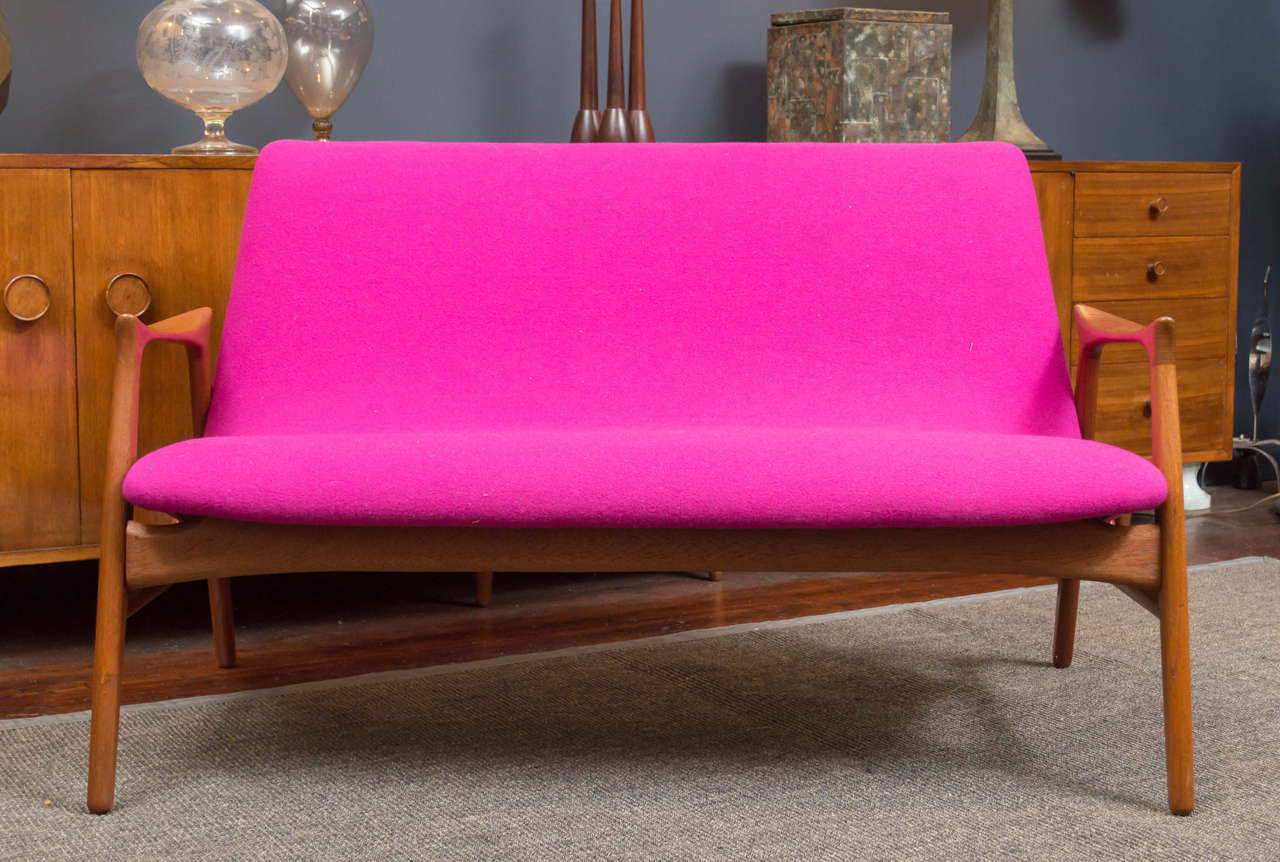 Hans Olsen design teak settee newly refinished and upholstered in Danish wool.
 Perfect condition.