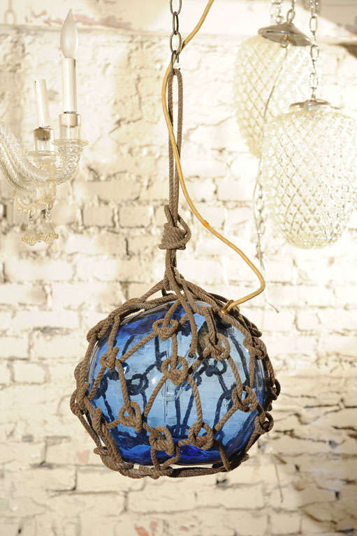 Japanese fishing float made into pendant light.  Bright blue glass,single socket.