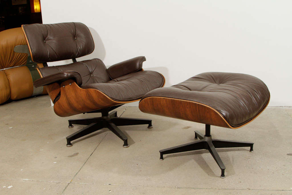 Herman Miller Eames Lounge chair (670) and ottoman (671) made with Brazilian Rosewood and brown leather. Signed. 

(Literature: Herman Miller.com Design Story - 

