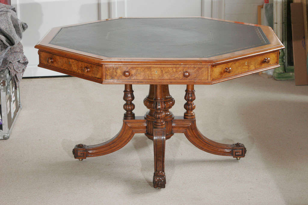 A superb and rare octagonal drum table by Gillows of Lancaster. Walnut veneers with leather top and four drawers and four 'dummies'.
Stamped Gillow and Co,
England, circa 1860.