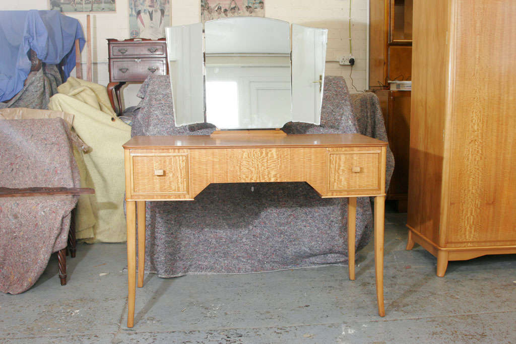 A mid century Dressing Table by Heals of London.<br />
Peroba wood with triple mirror.