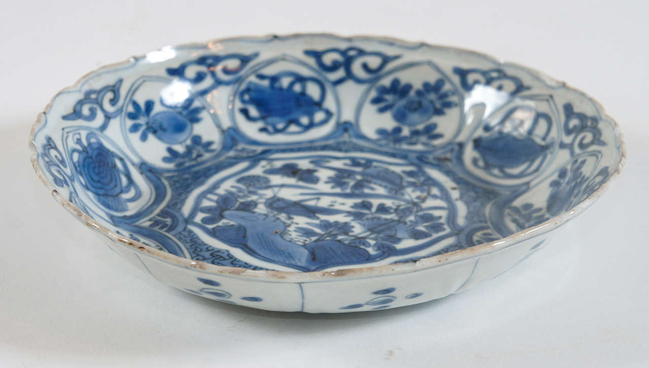 Beautiful Chinese Export 'Kraak' blue and white porcelain dish or shallow bowl made during the Ming Dynasty reign of Emperor Wanli (1572 - 1620).  See 'Kraak Porcelain - A Moment in the History of Trade' by Maura Rinaldi, p. 71, for documention of