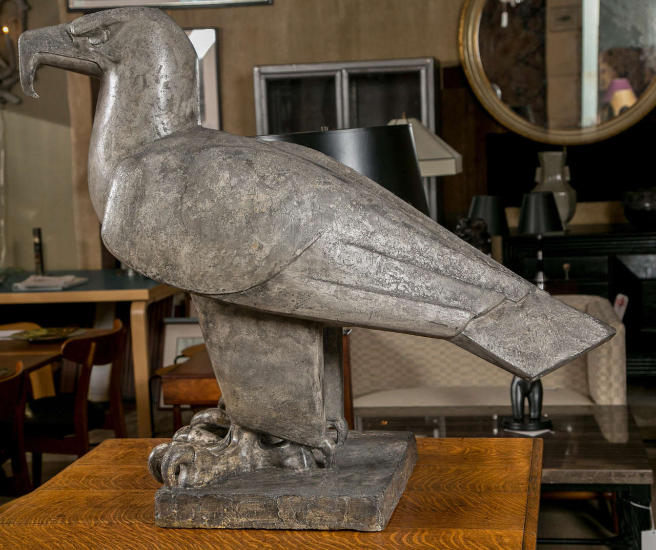 A large Art Deco architectural figure of a cast plaster stylized perched eagle.